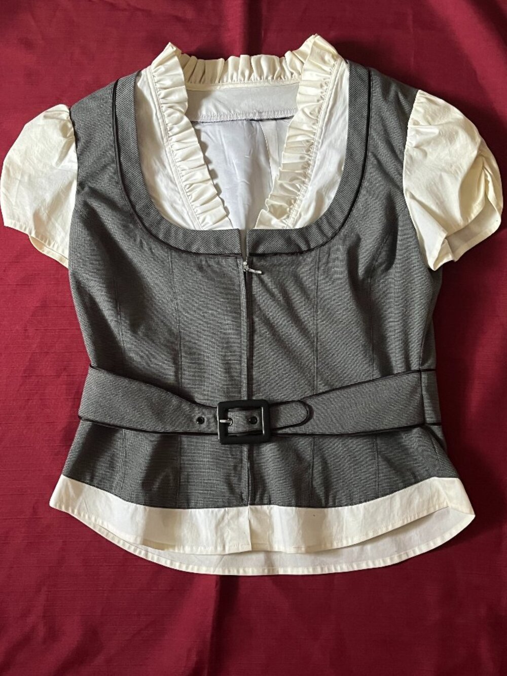Super cute tailoredgrey blouse style vest, with ruffle around the neck a Size M.
